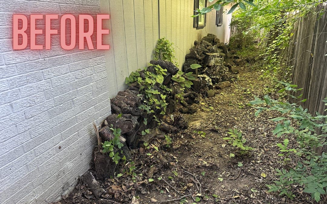Before: rocks and debris along a side yard