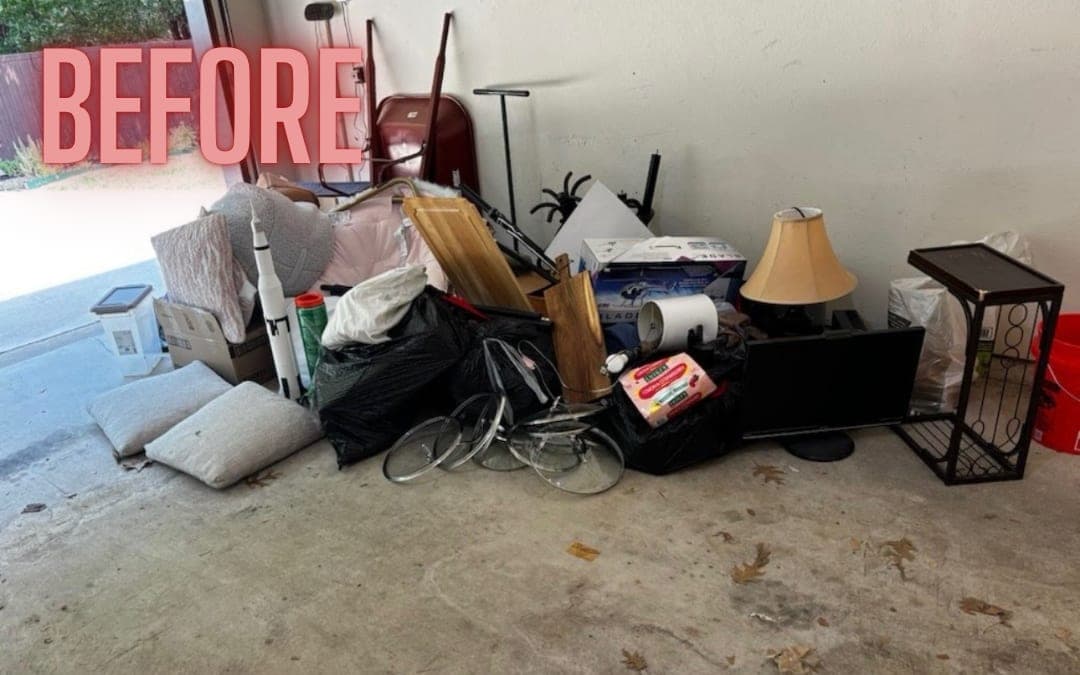 Before: a garage piled with furniture and household items
