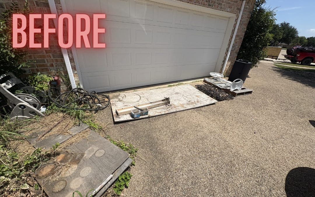 Before: debris on a driveway in front of a garage