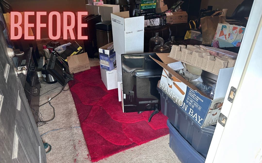 Before: a room crowded with furniture and boxes