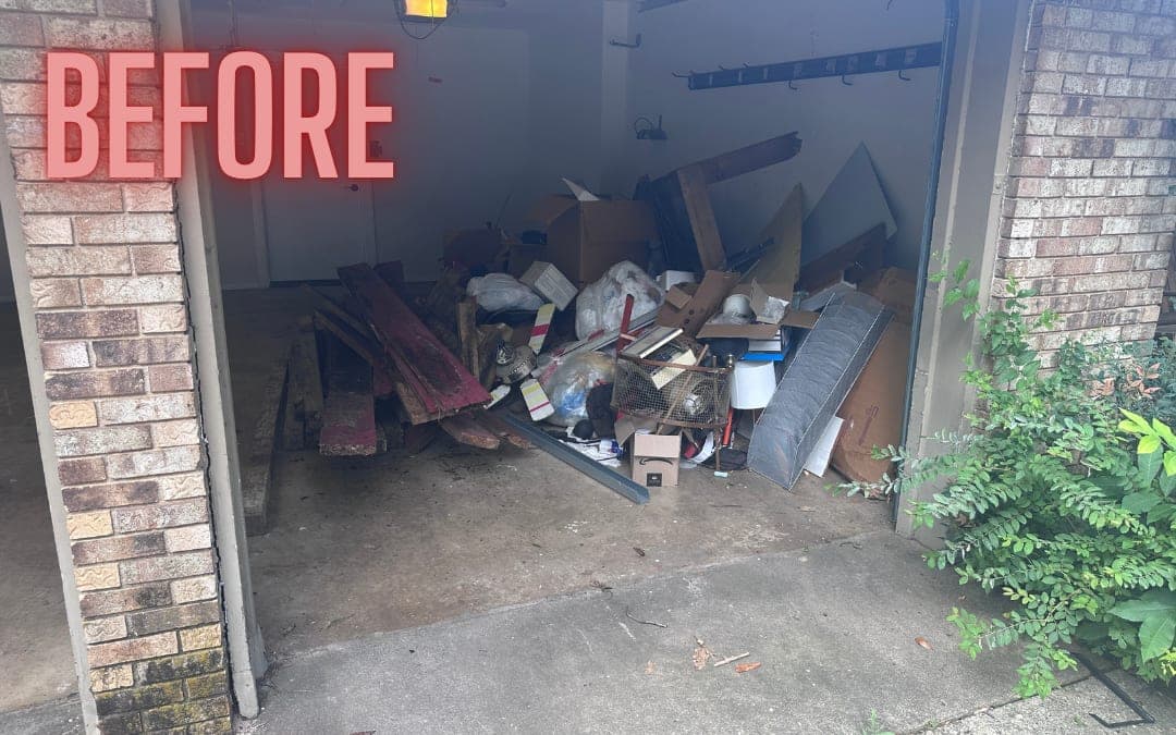 Before: a garage bay filled with wood and debris