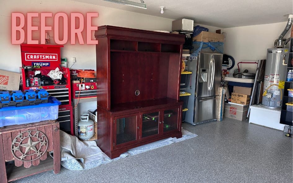 Before: a wooden entertainment center in a garage