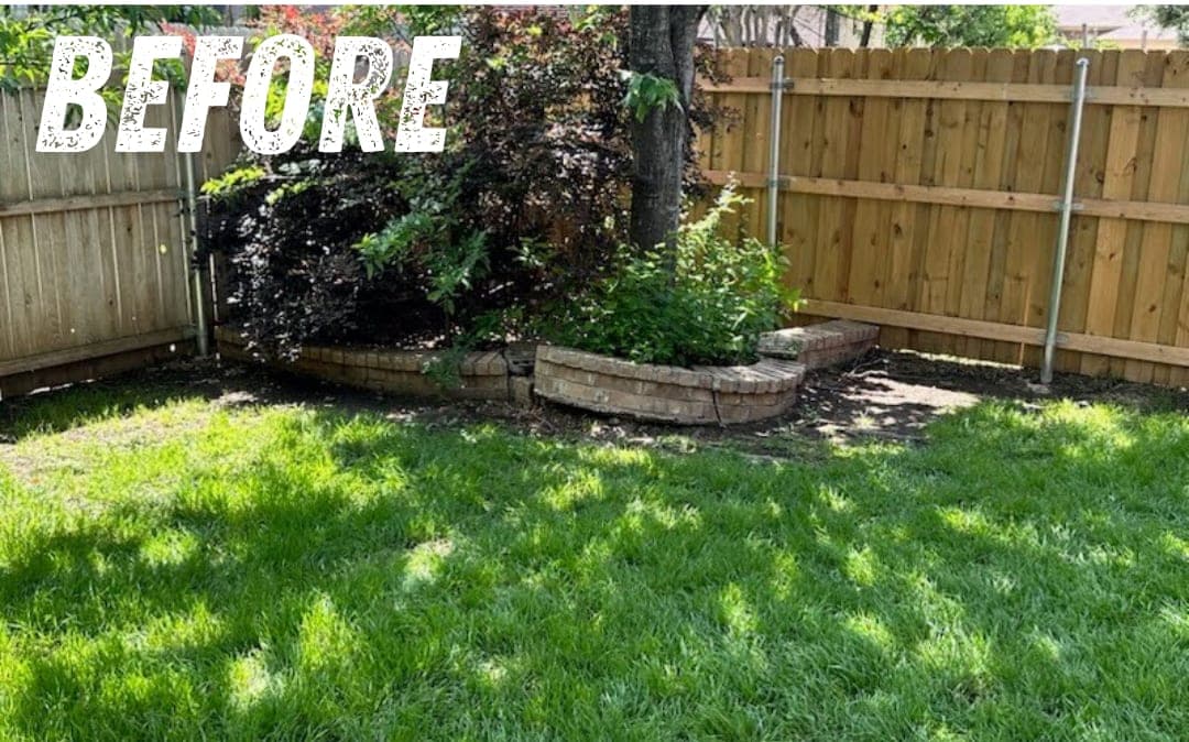 Before: a raised stone flower bed in a backyard