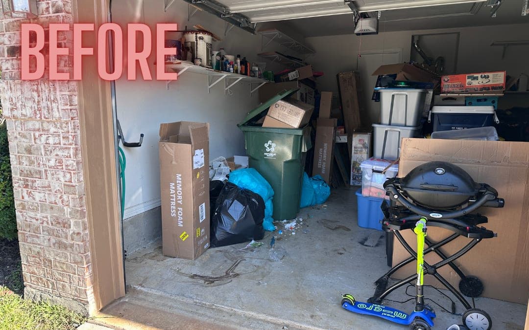 Before: a garage packed with bins, boxes and a grill